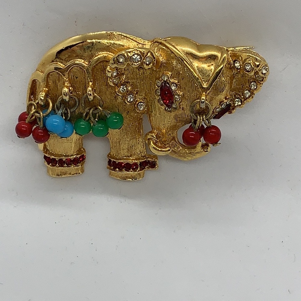 Vintage Gold-toned elephant with rhinestones.